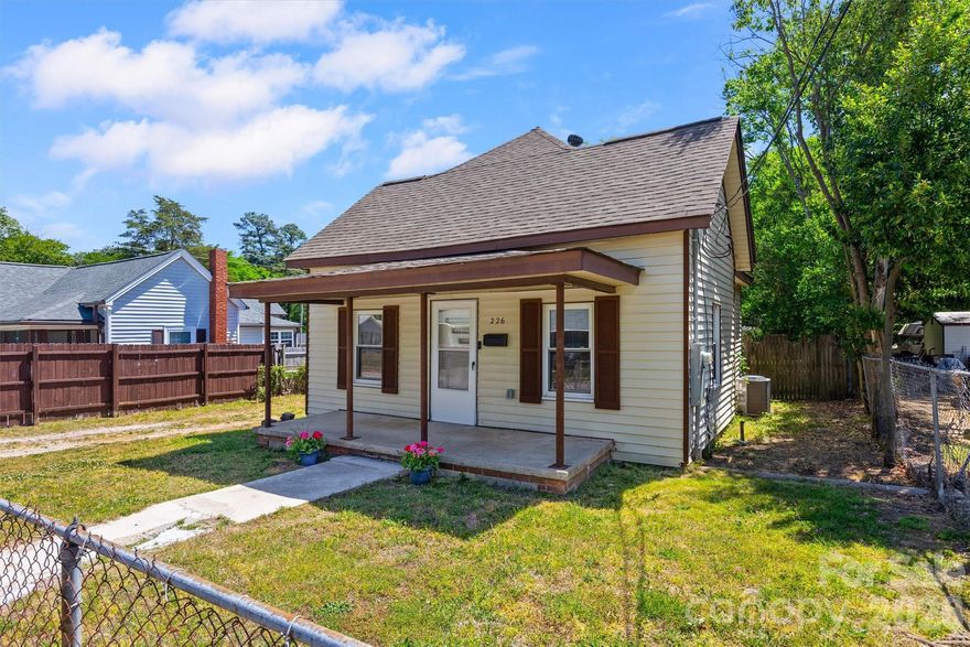 Welcome home to this charming ranch where all the heavy lifting has already been handled for you. Imagine starting your mornings with a quiet moment on the classic front porch before stepping inside to a bright, airy interior featuring fresh paint and sleek, modern flooring throughout. The kitchen shines with freshly painted cabinetry, stylish new hardware, and marble-inspired countertops, and you can move right in without a second thought since the refrigerator, washer, and dryer are all included. Out back, the expansive fenced-in yard offers a private retreat for pets or play, complete with a massive 14' x 15' storage building ready for your workshop or hobby gear. With a new roof (2024), HVAC (2023), furnace (2025), and a sealed crawl space, this home is ready to offer you total peace of mind from day one.