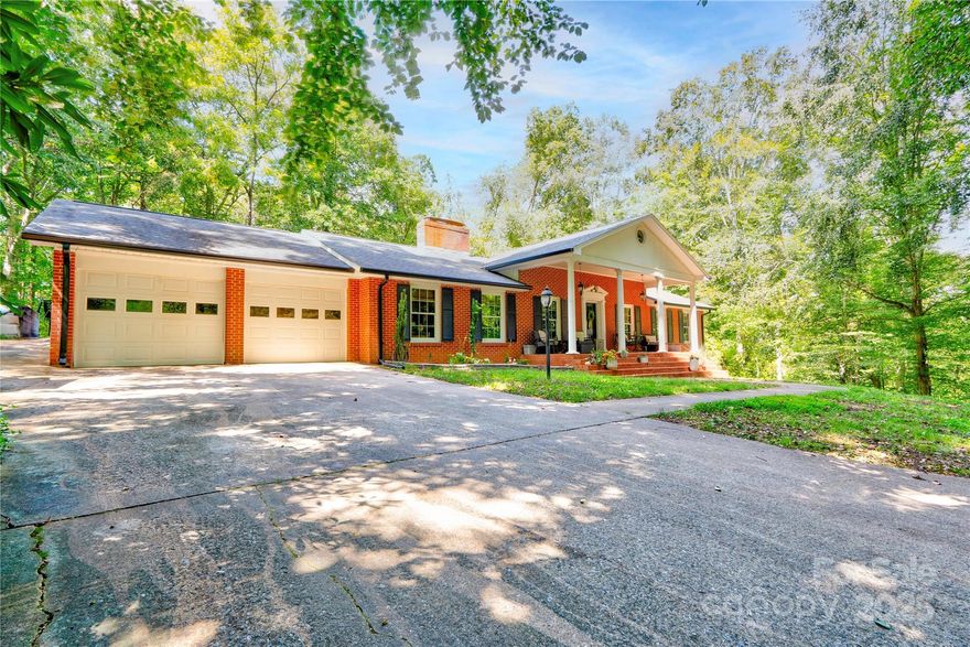Welcome home to this beautifully updated 4 bedroom, 2 bath brick ranch home, situated on over 8 secluded acres along the First Broad River, just outside the city limits of Shelby, NC! Built in 1967 and thoughtfully modernized, this home offers timeless character paired with today’s comforts. With over 1900 square feet of living space and a full un-finished basement, there’s plenty of room for everyone, plus flexibility for a workshop, home office or workspace! Enjoy a brand new custom-built covered deck off the back of the home, perfect for entertaining and relaxing! Additional features include a 2-car garage, wood burning fireplace, mature trees for added privacy, and plenty of space to make the land your own, bordered by nearly 400 feet of river frontage and creeks. This property offers the rare chance to enjoy modern living in a tranquil, natural setting—all just minutes from the conveniences of Shelby.