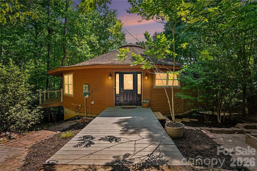 Tucked away on a private, wooded 1-acre lot with seasonal water views and no HOA, this beautifully updated 4BR/3BA lake-access retreat comes with a community boat launch & dock making it the rare blend of flexibility, privacy, and lifestyle buyers are searching for along the Lake Norman corridor.
The main level features renovated living spaces, an elevated kitchen with extra storage in the island and a pantry,  a beautiful new primary bath and updated 2nd bath, and expansive windows that bring the outdoors in. The second  bedroom has it's own private balcony.  Thoughtful updates to major systems including lower level separate HVAC, and new well pump, expanded septic provide peace of mind, while the flexible floor plan creates endless possibilities. Downstairs, the fully finished lower level includes a new second full kitchen, two new bedrooms, full bath, split-unit climate control, making it work for multigenerational living, guest quarters, or other expanded living options. Outdoor living shines with multiple areas to relax and entertain, surrounded by mature trees and natural privacy including a park like front yard oasis. And two driveways with one wrapping to the side of the property. Whether you’re launching the boat for a sunset cruise, hosting long weekends,  or simply enjoying the quiet lake-adjacent setting, this property delivers a lifestyle that feels worlds away while remaining convenient to Statesville, Troutman, and Mooresville.
A rare opportunity to own a turnkey lake-access property with versatility, character,  and tranquil living all wrapped into one. Agent is owner