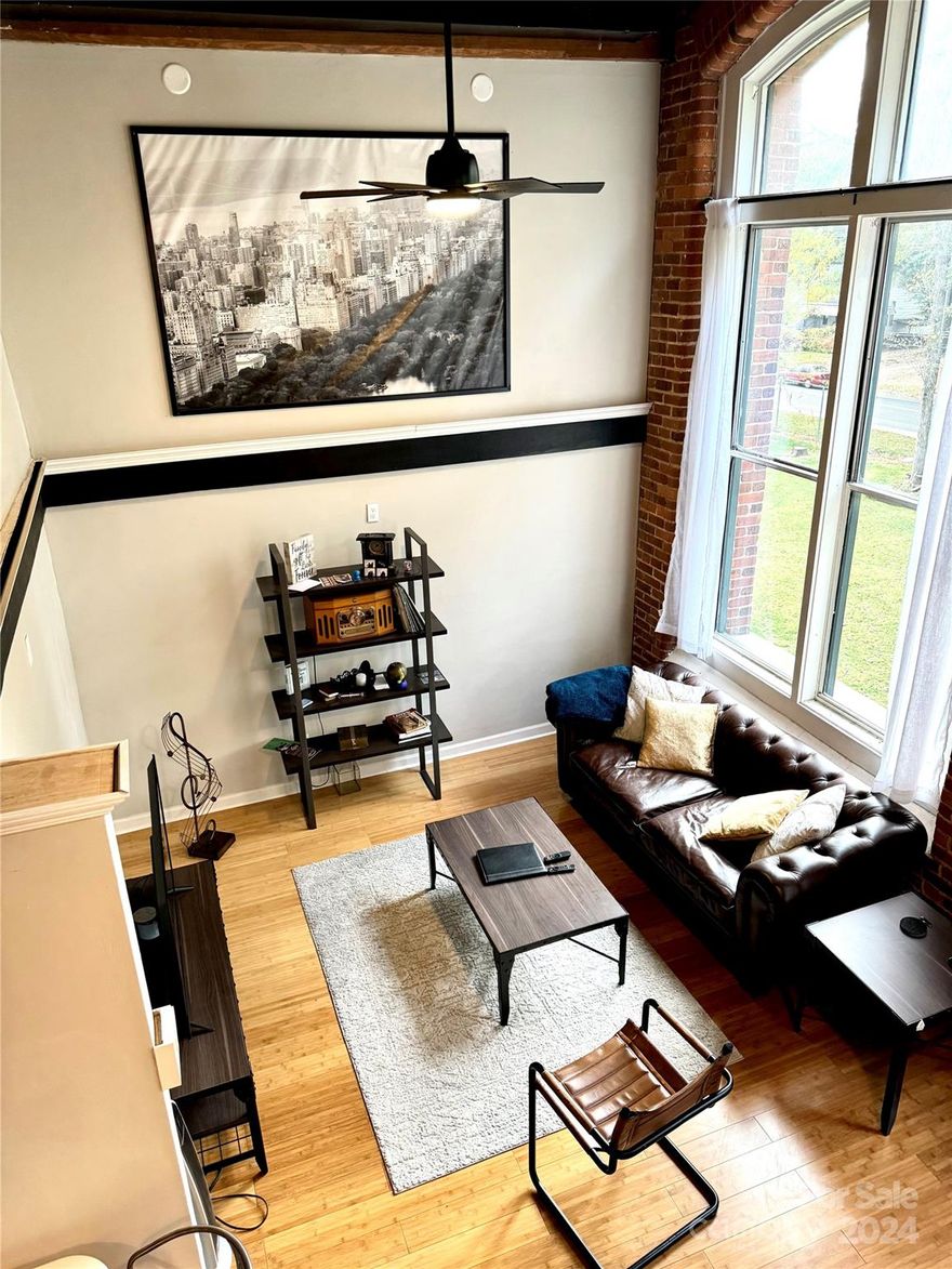 Experience Historic Charm with a Modern Twist! Step into this breathtaking 2-bedroom, 2-bath condo in the highly sought-after Historic Hoskins Mill Community! This unique unit is one of the few in the building with two full bathrooms, making it an excellent choice for co-living. Recently updated, this home is truly move-in ready. Located just 8 minutes from Uptown Charlotte, with easy access to major highways and Charlotte Douglas International Airport, this condo offers unmatched convenience. It seamlessly combines historic character with contemporary style. Revel in soaring ceilings, exposed wooden beams, and stunning 12-foot windows that flows with natural light, creating a bright, airy atmosphere. Whether you're looking for a cozy personal retreat or a spacious home to share, this condo provides a one-of-a-kind living experience you won’t want to miss! Back on the market, no fault of the seller