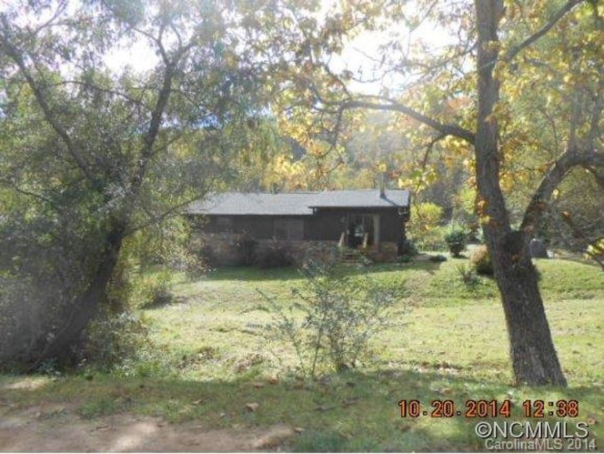 1961 1 story cabin on .36 acres with 2 streams. 1 bedroom 1 bath, office, family room, large kitchen and dining area. Could make good rental or primary residence. New roof.