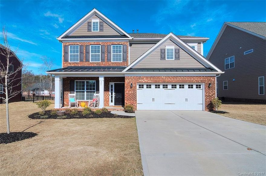 Better than new w upgrades galore! Gorgeous wide plank hardwood flooring & upgraded lighting throughout main level. Kitchen w granite counters, ss appliances, walk in pantry & butler's pantry. Fireplace w gas logs in the great room. Prewired media nook. Huge master suite with tray ceiling. Master bath w granite countertops & separate vanities. Spacious secondary bedrooms with bath. Laundry w cabinets & closet. Surround sound inside & out. Fenced, level backyard. Community pool. Fort Mill Schools