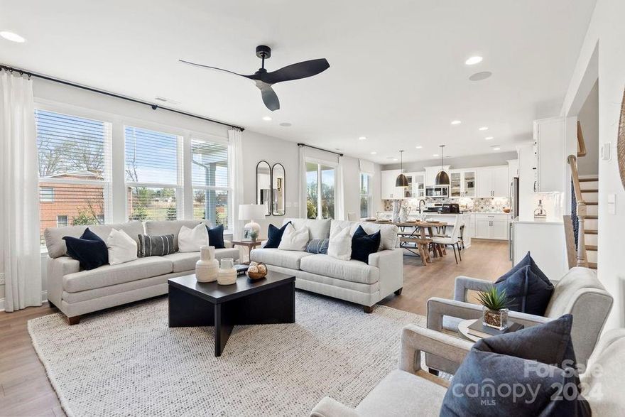 MLS#4168661  REPRESENTATIVE PHOTOS ADDED. Fall Completion! The Somerset floor plan at RIver Falls seamlessly combines style and versatility in a welcoming two-story home. The main level showcases an open-concept gathering room with a gas fireplace, a casual dining area, and a kitchen equipped with expansive countertops, an island with a breakfast bar, and a large walk-in pantry. Adjacent to the kitchen, you'll find a built-in valet and a guest bedroom with an adjoining full bath. Upstairs, the spacious owner’s suite features a dual-sink bathroom and an enormous walk-in closet. The second floor also offers three additional bedrooms, two full baths, a dual vanity bath, a laundry room, and a versatile loft. Structural options added include: first floor guest suite with full bath and walk in shower, fireplace, tray ceiling in dining room and owner’s suite, laundry tub , butler’s pantry, gourmet kitchen, and owner’s bath 2.