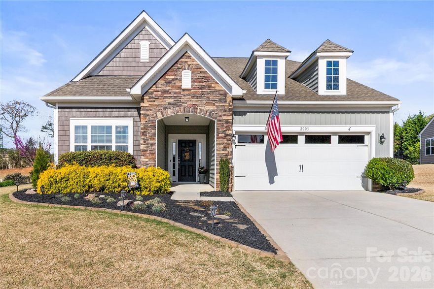 Welcome to a home that feels as expansive as it does intimate. This meticulously maintained 1.5-story residence offers a highly functional open floor plan designed for modern living without sacrificing the "cozy" factor. The heart of the home is the massive gourmet kitchen, featuring an oversized central island perfect for prep work or casual morning coffee, sleek stainless steel appliances, and a high-performance gas range. Seamless flow into the great room, anchored by a warm gas fireplace. The designated dining room is ideal for large dinner parties.  Experience the convenience of true main-floor living with a layout that puts everything you need within reach:  A primary suite that acts like a private retreat designed for rest and relaxation. You'll love the massive and upgraded primary suite closet. A secondary bedroom is also on the main level, perfect for a home office, guest room, or nursery. A convenient drop zone is located as soon as you eneter the house from the 2-car garage. Head upstairs to find a space that adapts to your needs. This level includes a third spacious bedroom and a full bathroom as well as a large bonus room perfect for a home theater, playroom, or a dedicated hobby studio. The transition to the outdoors is just as impressive. Enjoy your private oasis featuring a covered back patio for year-round entertaining, a fully fenced yard enhanced by landscape lighting for stunning curb appeal after dark. Located in a neighborhood that feels like a resort, you’ll have access to: Fitness center to skip the gym commute, pickleball & basketball courts for some friendly competition, and a cozy clubhouse for community gatherings. Come tour this home before it's gone!