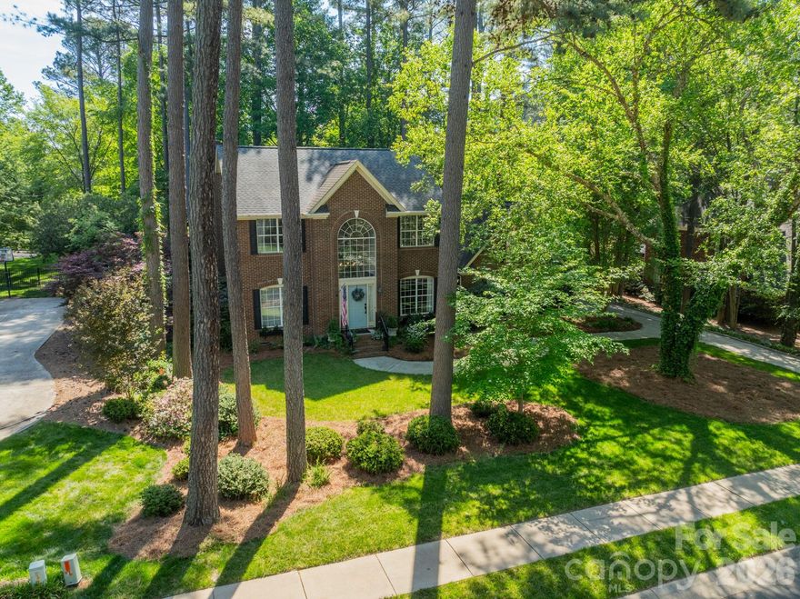 Offering space, privacy, and a touch of lake living, this exceptional two-story home on a flat, wooded half acre homesite delivers. The backyard offers a private retreat for entertaining or play. Inside, thoughtfully designed living spaces include lovely formal areas and a great room with stacked stone fireplace. The KT features granite countertops, double ovens, a breakfast bar, and a built-in desk. Enjoy the sunroom year-round offering access to the deck overlooking the serene backyard. UL primary suite with dual sinks, walk-in shower, & garden tub. Bonus room with full bath, generous secondary BR and hall bath with dual sinks. A deeded boat slip just a 3 minute walk from the house provides direct access to Lake Norman for for endless days on the water.