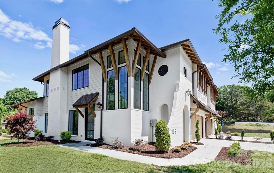 The Heather Duet sets a new standard for elevated living, offering over 4,200 square feet of thoughtfully curated space with a main-level primary suite and an expansive loft. Every inch of this home has been intentionally designed, delivering a level of finish and architectural detail rarely seen in its category.

From the moment you enter through the custom front door, the scale and craftsmanship are immediately apparent. Soaring ceilings, custom barrel vaults, arched openings, and exposed beams create a layered, architectural feel throughout, while engineered hardwoods, designer tile, and tailored lighting selections carry seamlessly from room to room. The living room fireplace anchors the main living space, adding warmth and dimension. The primary main level suite offers a true retreat with a 12’ ceiling and a spa-inspired bath, while spacious secondary bedrooms and a large loft provide flexibility for everyday living.

The kitchen features custom two-tone cabinetry from tile to ceiling, custom hood, quartz countertops, fluted island, and a premium JennAir appliance suite, complemented by a functional scullery. A 15’x10’ Pella sliding glass door system opens to the covered rear lanai with a fireplace, extending the living space outdoors and creating the ideal setting for year-round entertaining.

Additional highlights include Pella high-efficiency windows, an oversized garage with 18' custom wood doors, and thoughtfully integrated energy-efficient features including dual HVAC systems and Rinnai tankless hot water.

This is a rare opportunity to own a home where architecture, scale, and finish meet in desirable Ashbrook.