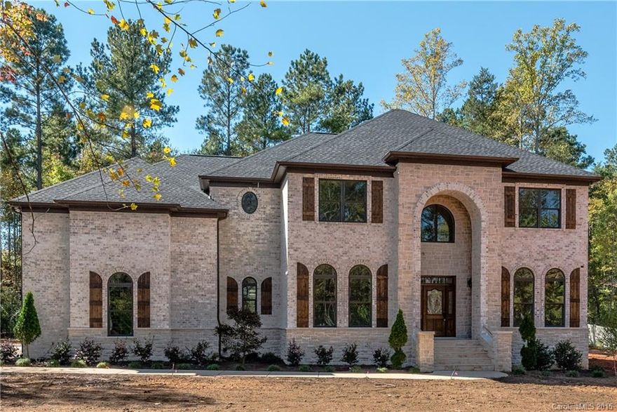 HUGE $45,000. REDUCTION !  Elegant New All Brick/Stone home under const. acre lot,Chef's kitchen w/ granite and SS Energy Star Appliances. Master Bedroom on Main, Formal LR and DR,Extensive Moldings, Surround Sound, Security System, Pre-wired for Central Vac. Cable, Intercom, Cameras, Network, Remote Home Mgmt. Arched Doorways, 3-car garage, Low-E windows, Sep. well for Irrigation, walk-in pantry, Flex room for office, craft, exercise, 2 HVAC systems, Winter lake view,  Brick/Stone Patio w/ FP.