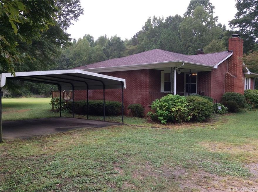 Quiet Country Living conveniently located to I-77, shopping and restaurants! All brick 1 story ranch ...new HVAC...new ROOF in 2013...new HOT WATER HEATER...Beautiful hardwood floors.....wood burning stove. A little TLC is all this home needs. Low county taxes. Property being sold "As Is".