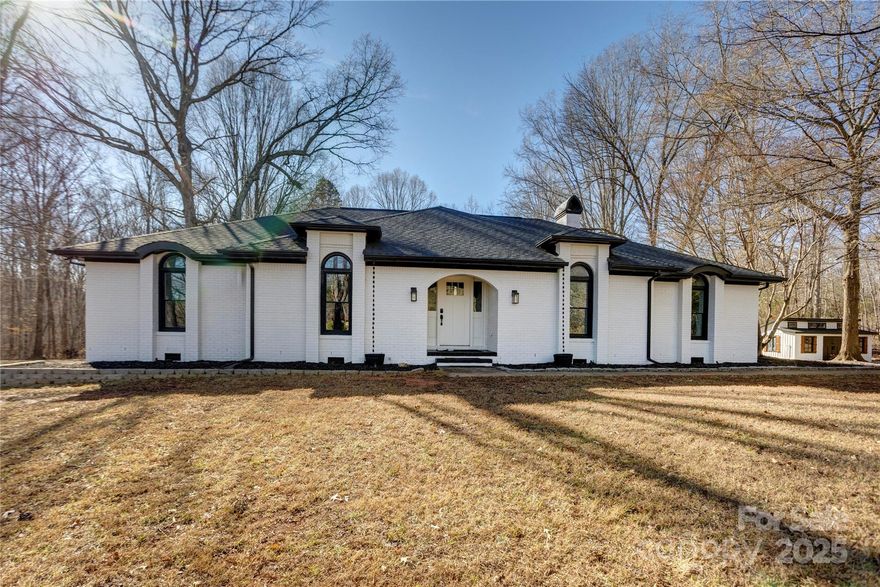 Update- Offer Chosen and submitted. Waiting for signatures from Relo Company. Multiple offers have been received. Asking for Best Offer by Tuesday Jan 6 at noon. Escape to the tranquility of country living with this stunning all-brick home set on nearly five private, wooded acres in beautiful rural Rowan County. Built in the mid-1980s, this house has been meticulously rehabbed and brought up to today's highest standards, offering a perfect blend of classic charm and modern convenience. 
Details include new light fixtures, subway tile, bath fixtures, cozy electric fireplaces, Mini beverage frig, farmhouse sink and engineered wood floors throughout.

The property is a true outdoor paradise and a hobbyist's dream. Enjoy the bonus features, including a barn and a wired workshop perfect for any project or extra storage. 

Entertaining is a breeze with a fantastic covered patio, complete with a top-of-the-line Blackstone grill for those summer cookouts. Gather around the charming fire pit, which is surrounded by exposed string lights to create a magical, cozy atmosphere year-round.

You can move in with peace of mind knowing the major systems are new: the hot water heater 2024, garage door and remote 2024, and architectural shingle roof was replaced in 2023. Plus the windows were new in 2025.  The sellers have been relocated with their job and are going to miss this amazing space. 
According to the county
department of health, the septic permit is unavailable.
Don't miss the opportunity to make this completely updated rural retreat your own!