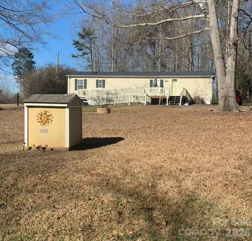 Charming 2BR/1.5BA Home nestled on 0.88 acres in Iron Station, NC, offering wooded privacy and a quiet rural setting. Enjoy the warm country feel with a new roof, mature trees, and plenty of space to garden, relax, or simply soak in the peaceful surroundings. This sweet and affordable country haven offers room to breathe and unwind, your own private slice of the countryside. Low Lincoln County taxes. Conveniently located just 10 minutes to groceries, banking, restaurants, and shopping, and only 40 minutes to Charlotte Douglas International Airport. A perfect little retreat that combines comfort, nature, and the simplicity of true country living. Storage building to convey as well as the washer, dryer and fridge present. No HOA!