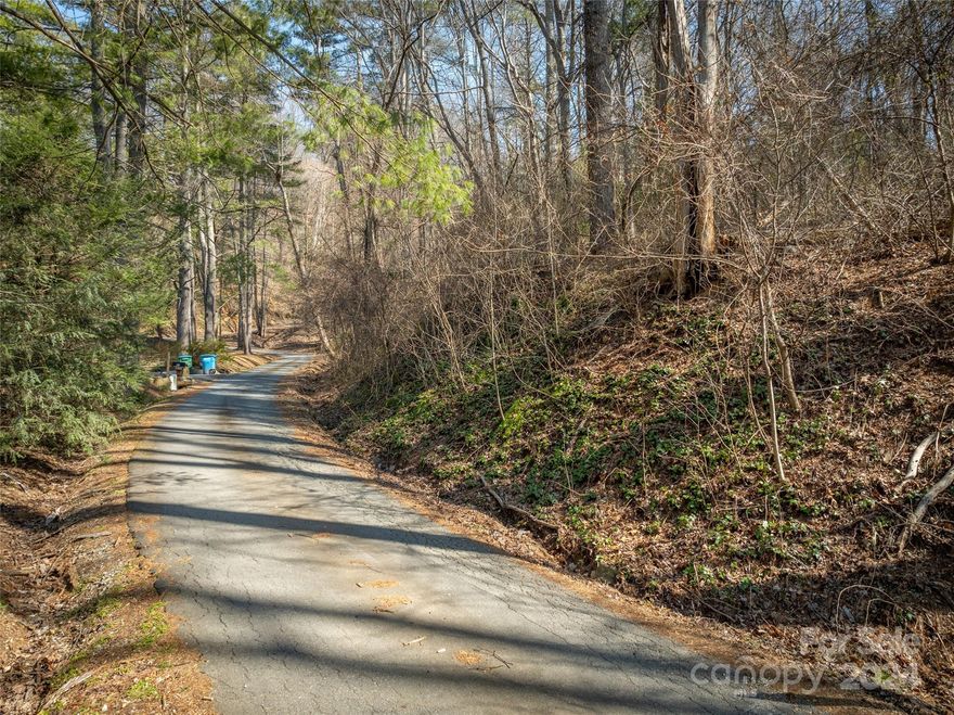Multiple Offers Received, Seller request Highest and Best by 6 pm Thursday Feb. 29th. Perched above the road, two wooded building lots in established neighborhood for a total of .71 acre. Includes PIN # 965437922500000 & 965447030500000, buyer to confirm availability of public water and sewer, easement in place for sewer. Conveniently located in Mount Royal with easy access to shopping, great schools, dining, airport and the amenities S. Asheville is known for. Shared access agreement from 7 Azalea Ct., see attached plat.