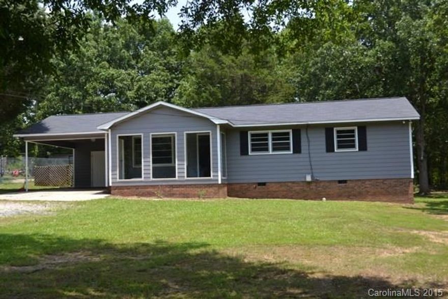 Cute ranch home offers spacious great room and open kitchen with breakfast area! Enclosed front porch, lots of yard, and carport.  Move in ready!