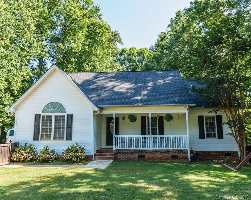 Gorgeous, inviting, front porch. Large flat private wooded lot. Entry way, Vaulted great room with Palladium window. large kitchen with generous size breakfast area, with door to deck. Large master down with walk in closet and master bath.  Upstairs has two additional bedrooms, Bonus area with Large walk in closet with in wall plumbing so bath could be added. Large shed in back for storage.