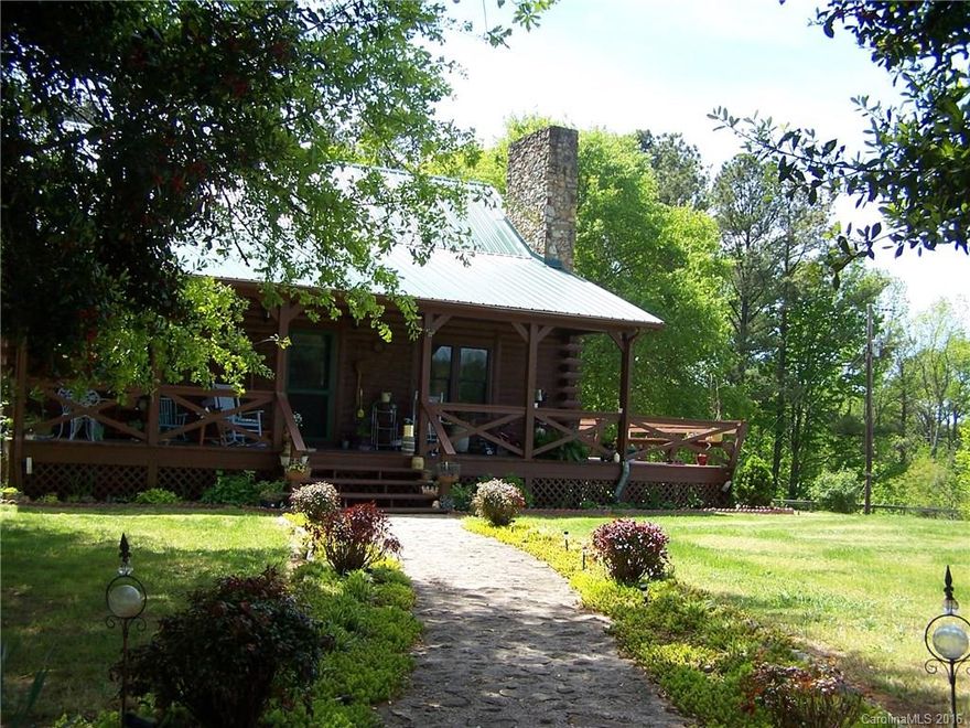 17Acres of beautiful serene country living Log cabin w/finished basement apartment w/2nd kitchen. 2 horse stable/barn. Approx. 4 acre pasture fenced & ready for horses. Property boast beautiful landscaping w/pond in pasture. Master suite has a walk out balcony & a private sitting room.  Cozy stone fireplace w/gas logs. Clean crisp updated kitchen. New Pella windows, heat pump & metal roof. Four foot above ground pool to cool you off on those hot summer days. 30x30 building with concrete floor