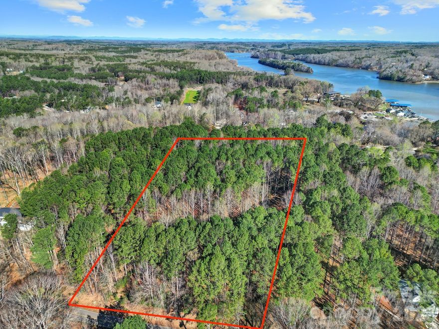 Beautiful homesite located in The Summit on Lake Norman—an ideal setting to build your dream home. Enjoy access to a natural waterfront community park, offering a peaceful and scenic side of Lake Norman for all residents. Minimum square footage requirements vary depending on the number of stories. Conveniently located just minutes from Long Island Marina for easy access to fuel for your boat or jet skis. The neighborhood also features dedicated boat and jet ski storage.
