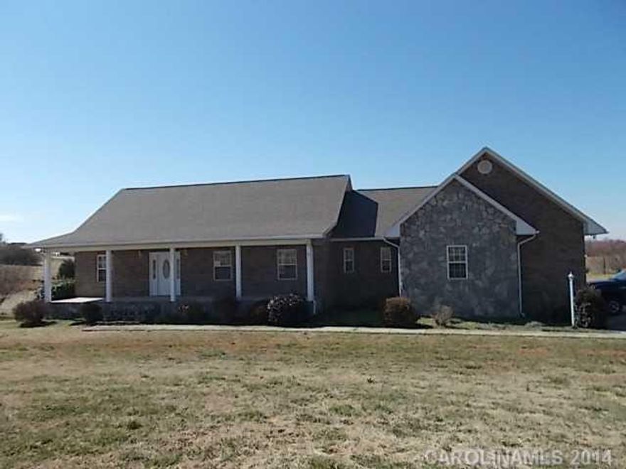 Lovely rocking chair front porch welcomes you to this  Freshly painted ranch home with full unfinished basement.  Split floor plan, living room has hardwood floors and french doors to the deck, open floor plan.