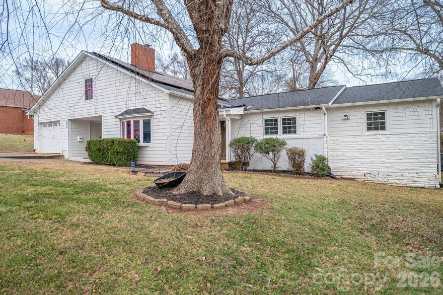 Four-bedroom, three full bath home with a fully fenced backyard and extensive updates. The home includes two primary bedroom suites (one downstairs and one upstairs) and a large laundry room with gas or electric dryer hookup. The owner is using one bedroom as a pantry. A Dutch door connects the kitchen to the sunroom, and the property includes a generator hookup. This unique home was featured on Montel Williams’ Military Makeover show. A 21-panel solar system and roof were installed in 2018. The home was fully remodeled in 2020, including a Goodman HVAC system with all new ductwork, new windows and doors, updated flooring throughout, quartz countertops, backsplash, and bathroom counters, stainless steel appliances, Rayno window film, a Lorex security system with no monthly fee which includes cameras for a 360 degree view of the property, garage floors were refinished and cabinets installed by Garage Experts, tankless water heater, and so much more. A gas oven was added in 2025. The backyard includes a greenhouse installed in 2020, Vego raised garden beds with trellises added in 2024, an outdoor planters bench with sink, a storage building, and a chicken coop with run that will remain. Chickens may or may not convey at seller’s discretion. The flock consists of laying hens producing brown and white eggs, including rare Lavender Orpingtons and other breed. Established bushes/plants that remain include blueberry, blackberry, raspberry, elderberry, comfrey, mint, a peach tree, and a banana tree.
Pellet stove in living room works in manual mode but not auto mode.  Seller thinks it might need an auger. Mini-split in the workshop is not working, seller thinks it needs freon.