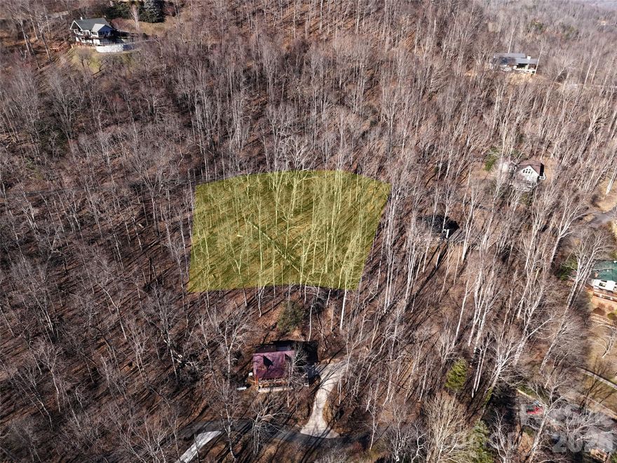 Motivated sellers and priced to sell. Escape to the mountains with this vacant land opportunity in the established Maggie Valley Country Club Estates. Tucked behind Maggie Valley Country Club, this .77-acre wooded homesite offers privacy, seasonal winter views, and a partially pushed-in driveway that helps you envision your future mountain retreat.

Enjoy the convenience of paved road access and city water, making the path to building easier. Seller has indicated the property previously perked for a 3-bedroom septic system, though documentation is not available. Buyers should complete their own septic evaluation based on intended house plans and requirements.

Minimal HOA fees apply. A road maintenance fee is assessed at the time of construction and based on square footage.

Located approximately 15 minutes from Waynesville, NC, and convenient to the Blue Ridge Parkway, Cataloochee Ski Area, hiking, dining, and year-round mountain recreation. Whether you're planning a full-time residence, vacation getaway, or investment build, this lot offers location, value, and potential.

Bring your vision and start building in the Smoky Mountains today.