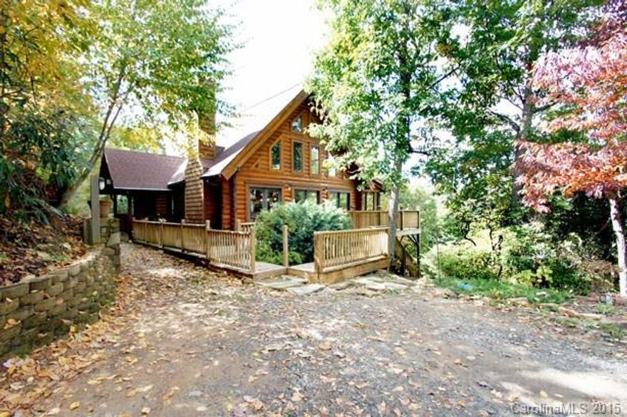 FINALLY! THE LOG CABIN you've always wanted is on the the market for the first time! Stunning cypress log cabin masterfully created w/ an array of natural elements - cedar-lined closets, hickory floors & maple cabinets w/ open floor plan, 2-story great room, bronze fixtures & solid surface quartz countertops in kitchen & pantry. Sylvan surroundings complete w/ stream ensure privacy while still boasting sweeping views across the Swannanoa Valley. Convenient to I-40 although you'd never know it!