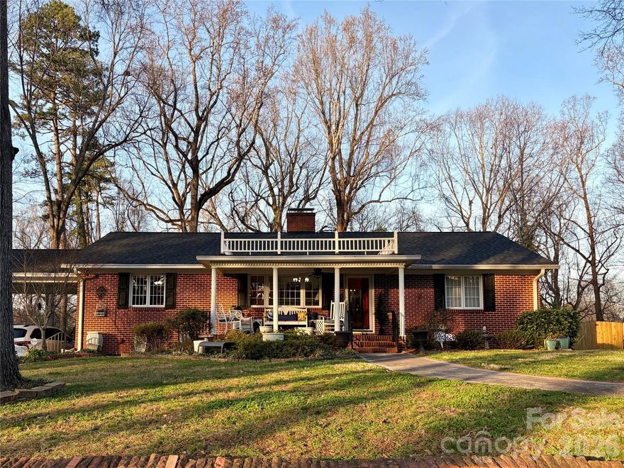 Step into timeless charm and exceptional living spaces! This beautifully maintained custom-built ranch offers over-sized rooms, hardwood floors, updated lighting and a thoughtfully designed floor plan including a sun room & a home office! Every room offers generous design & comfortable living for families of all sizes! The home features three large bedrooms, each offering plenty of space for furniture and relaxation. A dedicated home office ideal for remote work, studying, or a creative studio. This space could also be easily converted to a breakfast room. The owner's suite includes a renovated en-suite with an over-sized tile shower with dual seating. The second and 3rd bedrooms share a Jack & Jill style full bath. The half bath is conveniently located to serve both your family and your guests. The heart of the home presents a beautifully renovated kitchen featuring LVT, white cabinets, a gas range, granite counter tops, and updated lighting. Warm and inviting gas log fireplaces in both the den and the sun room, while a wood burning fireplace is featured in the main living room creating multiple cozy spaces for relaxing or hosting guests. The bright climate controlled sun room is perfect for morning coffee and year-round enjoyment. The large covered front porch features a faux balcony portico adding classic curb appeal. The generous sized back deck is made with long lasting composite material and is the perfect spot for entertaining friends & family, or the place for your peaceful tranquility. The double car port with additional parking for multiple cards in the driveway adds convenience. Quiet creek along back rear property line. The basement has exterior and interior entry, was once a studio apartment, and offers over 1,800 square feet of heated and cooled space waiting for your custom design to create additional space for your family or in-law quarters. Priced well below tax value, this home offers exceptional opportunity and is truly a must see!