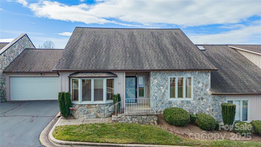 Must see this spacious 2BR 2Ba townhome within minutes of everything in the beautiful "Pebble Creek" community. Home has had some recent updates including new kitchen cabinets, stainless steel appliances and granite countertops. All 1 level living w/very few steps into front door. Home features large living room w/stone fireplace which just needs a set of gas logs. Tall ceilings make home feel larger than it actually is. You will also enjoy your morning coffee from screened in porch plus enjoy convenience of attached 2 car garage.