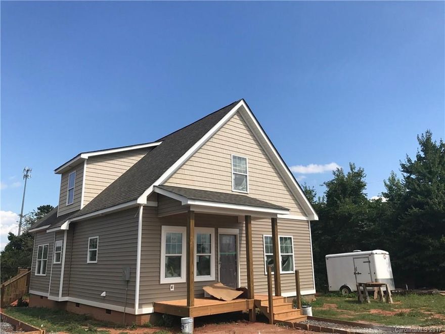 Your next home is almost built! Home on over a half acre lot that has a below ground WINE CELLAR! Home has many upgrades including CUSTOM cabinets, GRANITE countertops, HUGE kitchen island for food prep and seating! Kitchen and living room provide for great open floor plan and access to large deck for entertaining! Beautiful HARDWOODS in kitchen/living room! Location provides easy access to boat launch, LKN State Park, I-77 and a short walk/drive to Daveste Winery! Welcome home!