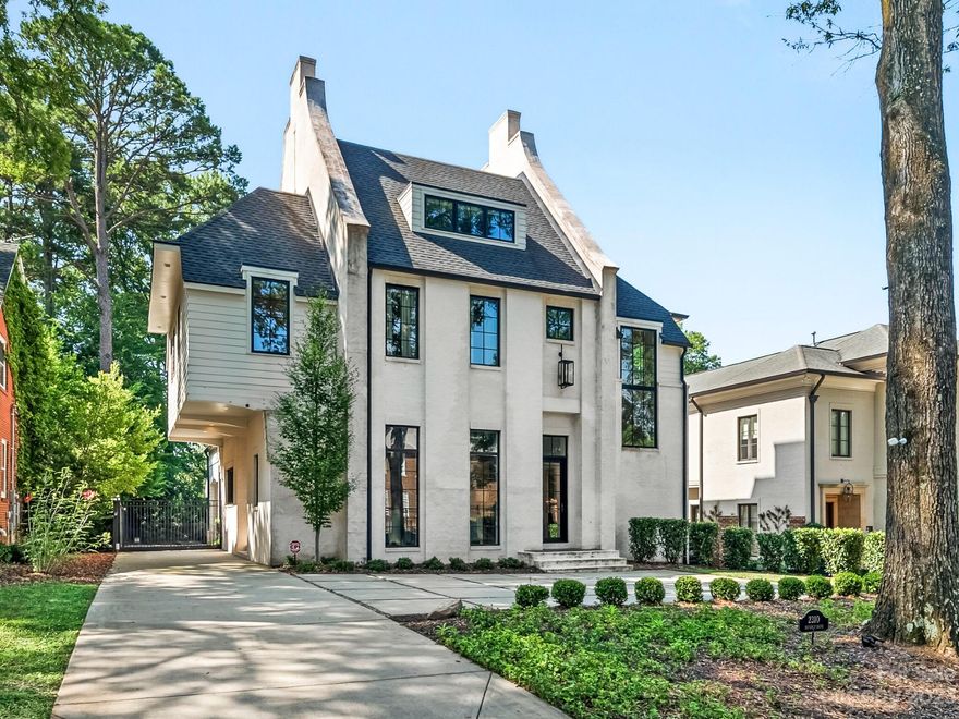 Breathtaking 2.5 story, European-style home on one of the most desirable streets in Myers Park. The main level features hardwood flooring, exquisite light fixtures, oversized windows. Formal LR w/ built-in bookcase and cabinets. Butler’s pantry w/ SS sink, granite countertops, abundant storage, dishwasher, wine fridge, warmer oven & pantry. Chef’s kitchen features oversized island w/ marble countertops and farm sink, Thermador appliances, and dining area. The kitchen opens to the family room w/ a floor-to-ceiling gas log fireplace. French doors open to covered back porch and sliding glass doors open to the Bluestone patio. The second level has 4 bedroom en-suites, laundry room. The primary bedroom has a sitting area, two custom walk-in closets, and luxury bath with dual vanity, deep tub, & oversized shower. Third floor rec room has a home theater set up. Detached two-car garage w/ outside stairway access to guest suite above featuring a living/bedroom area, kitchenette and full bath.