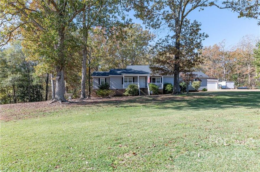 Amazing opportunity to own a home that is out of town to feel secluded but close enough to be at all shopping within 2 miles.Beautiful 1.5 story 2200 sq ft home with 5 bdrms & 3 full baths situated on 3.3 acres.Home features large living rm with gas logs, kitchen has plenty of cabinets and pantry, and is equipped with dble electric ovens and free standing gas range.Primary bedroom is on main floor, has full bath and large walk-in closet.Very large sunroom/dining room with doors opening to a covered porch.ATTN all men, there is a workshop like no other. approx 1600 sq ft insulated shop. Shop has electric dble garage doors, plumbed with sink & outdoor hose connections.Shop is on a separate 200 amp electric service meter, equipped with LED lights and electrical outlets on 3 walls.Shop is wired & plumbed with multiple outlets for air compressor and also welder electrical outlet. Back yard has a 35x35ft chain link fence area for pets.Large chicken coop with 8x10 fully enclosed run included.