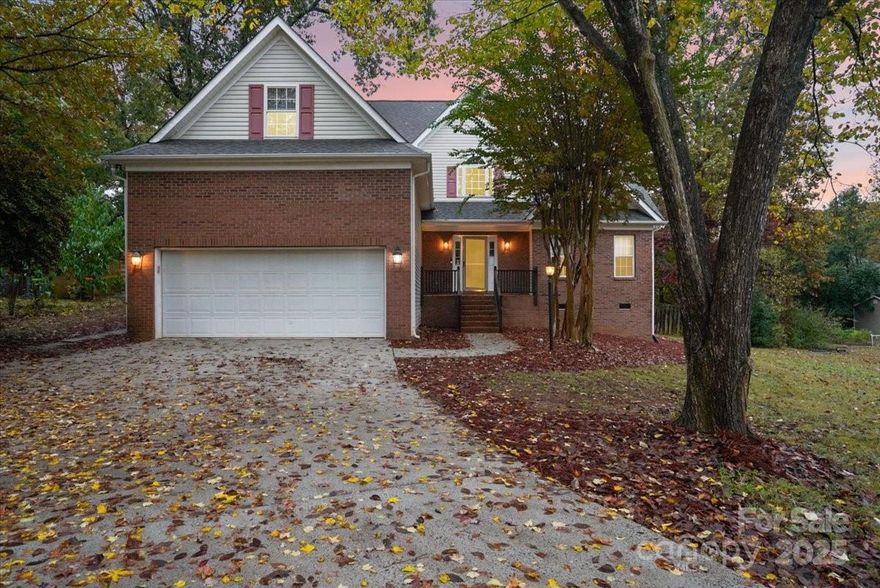 Union County home on almost half an acre with mature trees in highly sought after Country Woods East, minutes from 485 and shopping, wonderful union country schools.  Best of All—NO HOA-bring your boats/RV's! 
The front door opens to a dramatic two story great room with a gas fireplace and new ceiling fan and light fixture. The layout flows seamlessly into the dining area and kitchen.  The kitchen has a large island, an abundance of 42" cabinets, gas stove, refrigerator and 2 pantries. The hardwood floors are recently refinished and beautiful. This open floor plan is perfect for entertaining or daily living.
Tucked away on the main level is the primary suite that features a tray ceiling and large windows.  The ensuite bathroom has a garden tub, double sinks and separate shower and toilet closet
Upstairs you will find two bedrooms and a bonus room with access to the upstairs deck.  Hardwood floors in all bedrooms and bonus.
The two car garage has a storage shelf built in for all the extra storage you will need.  There is a pad in the backyard for a hot tub with electrical already in place.