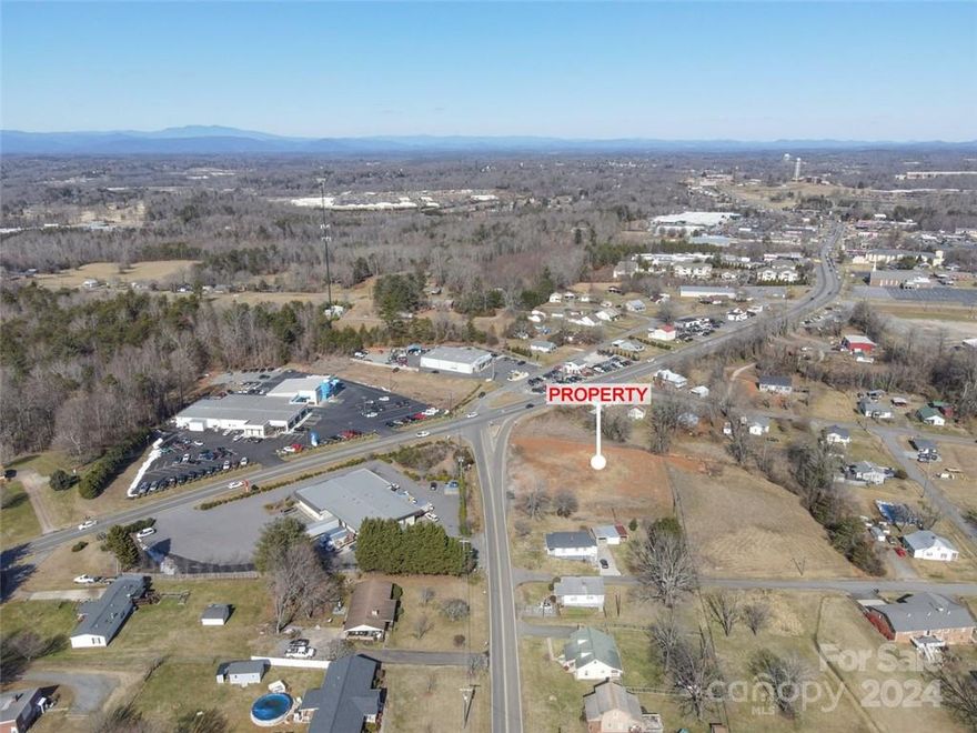 THE LAST COMMERCIAL CORNER TRACT. 0.8 miles to I-40. Also includes (Record# 8876, PIN 1792841069) combined 2.5+/- acres. Zoned GB-CU. High traffic Visibility. Wide variety of commercial, business and office uses. Underground natural gas & utilities available. Adequate City water and sewer present to serve any commercial use proposed. Close businesses include LOWES, Rural King, Big Lots, Food Lion, Morganton Honda Dealership and multiple National Fast Food Chains. (refer to MLS#3577136)