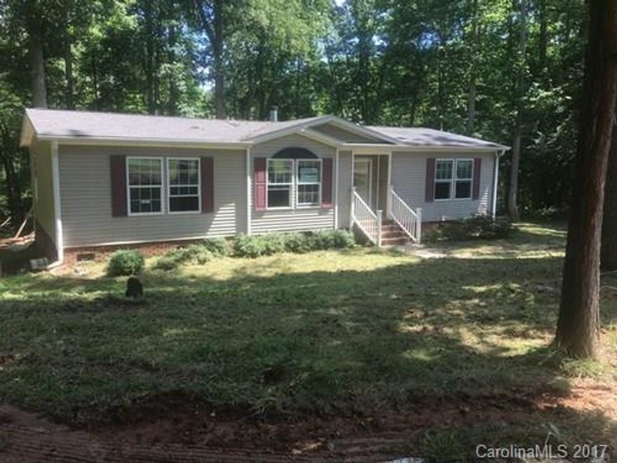 Home offered as is to cash buyers only 2008  3 Bedroom 2 Bath Living room with Stone Fireplace Kitchen with Cook Top and in Wall Oven and Microwave (Black) Dining Area Master Bath has His and Hers Vanity ,Garden Tub with Separate Shower Vinyl Tilt Windows, Heat Pump with Well and Septic Gravel Drive on 2 Acres.