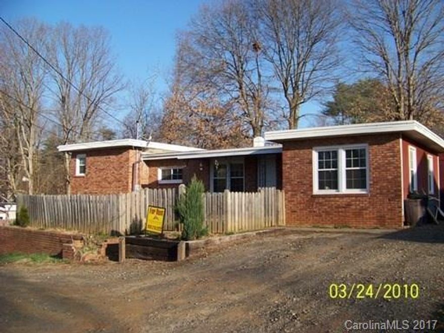 Affordable West Asheville fixer upper! Poperty is being sold "As Is".  Home located just off Patton Avenue at the end of the road.  3 bedroom - 1 bath on main level.  Lower level has roughed in bath, laundry and workshop/family room.  Front yard is fenced in. Two pins 9628-54-3516 (house AND .12) and 9628-54-2691 .04 lot.  New vinyl double pane windows installed recently.  Home is currently rented at $900 monthly.