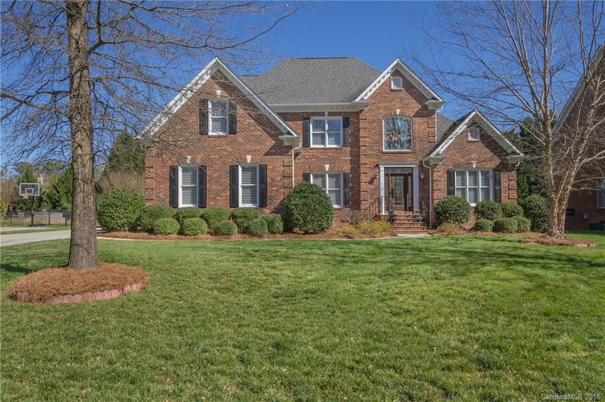 Providence Country Club... Master Down...Full Brick!!! 4 Bedroom + Bonus. Abundant hardwood floors, Upgraded Kitchen w/fireplace, sitting area, huge island w/storage, granite, top-of-the-line SS appliances w/WOLF wall ovens & WOLF Gas Cooktop!  Vaulted ceiling & fireplace in Great Room, Formals/Study. Gorgeous yard w/ inground irrigation, exquisite landscaping & fully fenced backyard! Multi level Deck & Grill Gas Line for entertaining. Custom Garage. Walk to Blakeney Shop/Dining & The Fountains!
