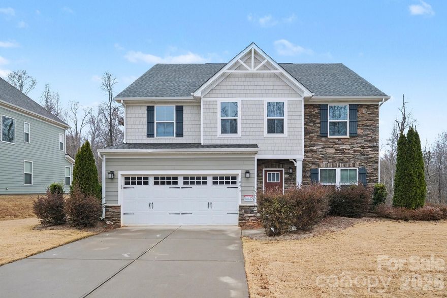 A rare investment opportunity! This immaculate 2018-built home located in the highly desirable prime location of the Harrisburg–Charlotte border, offers a Charlotte address with the added benefit of lower Cabarrus County property taxes—providing exceptional value and strong long-term resale appeal. Featuring 3,269 sq ft of open-concept living space, the main level includes a dedicated office and a chef’s gourmet kitchen featuring stainless steel appliances including a gas range with double ovens, granite countertops, walk-in pantry, and an oversized island overlooking a dining area with abundant natural light—ideal for entertaining and everyday living. Upstairs offers a spacious primary suite with dual walk-in closets and a spa-inspired bath. Secondary bedrooms are well-appointed, including one with a private ensuite full bath perfect for guests. A versatile loft provides flexible space for a media room, fitness area, or additional living space. Fenced backyard offers privacy and room for outdoor enjoyment.