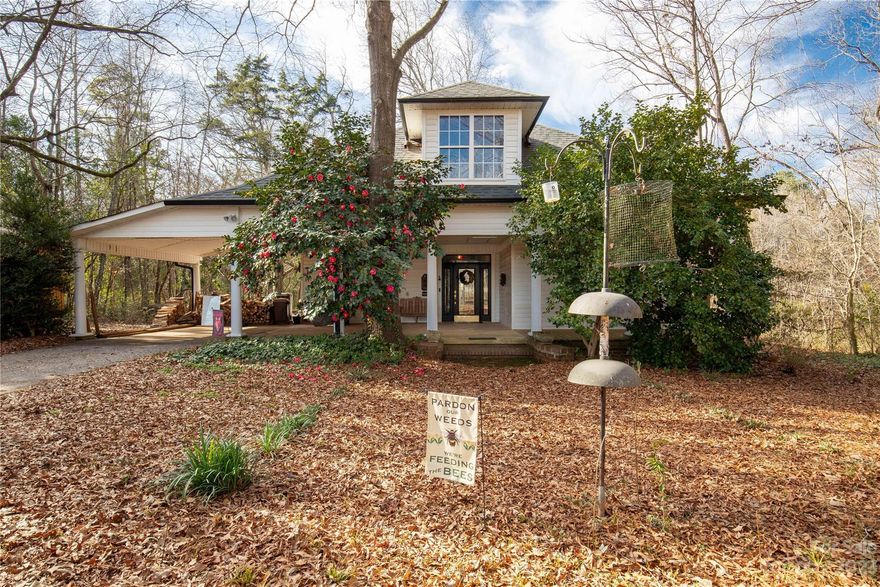 One-in-a-million chance to own an 11-acre nature preserve with pond and trails. One-story move-in ready farmhouse lovingly maintained and upgraded. Beautiful kitchen with granite countertops and stainless appliances-washer and dryer in adjoining laundry. Two bedrooms, two full baths; office convertible to third bedroom. Furnace, tankless water heater, living room logs use natural gas; central air cooling. Entry hall with gorgeous soapstone woodstove for supplemental heat. Glassed-in sunroom, spacious covered front porch with carport, ramped back deck offer views of woods, pond, sunsets. Septic, roof, gutters almost new. Large unfinished attic awaits your design; outbuilding has storage and workshop area. Idyllic property is a mile or two from downtown York with easy access to Rock Hill and Charlotte but you'll feel like you're in the woods among lush trees and wildflowers. Current owners report 173 bird species - including a large hummingbird population. Nothing like it on the market!