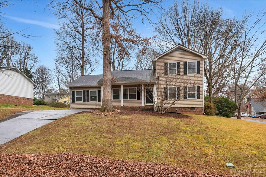 Discover a charming two-story gem on a corner lot with 4 bedrooms, including a main-level owner's suite. No HOA fees! Enjoy the convenience of being a stroll away from Goat Island Park, while relishing the tranquility of mature shade trees from your covered rocking chair front porch. This home features an encapsulated crawlspace, a cozy wood-burning fireplace, and an oversized deck in the backyard—perfect for entertaining. Experience comfort, convenience, and natural beauty in this desirable home.