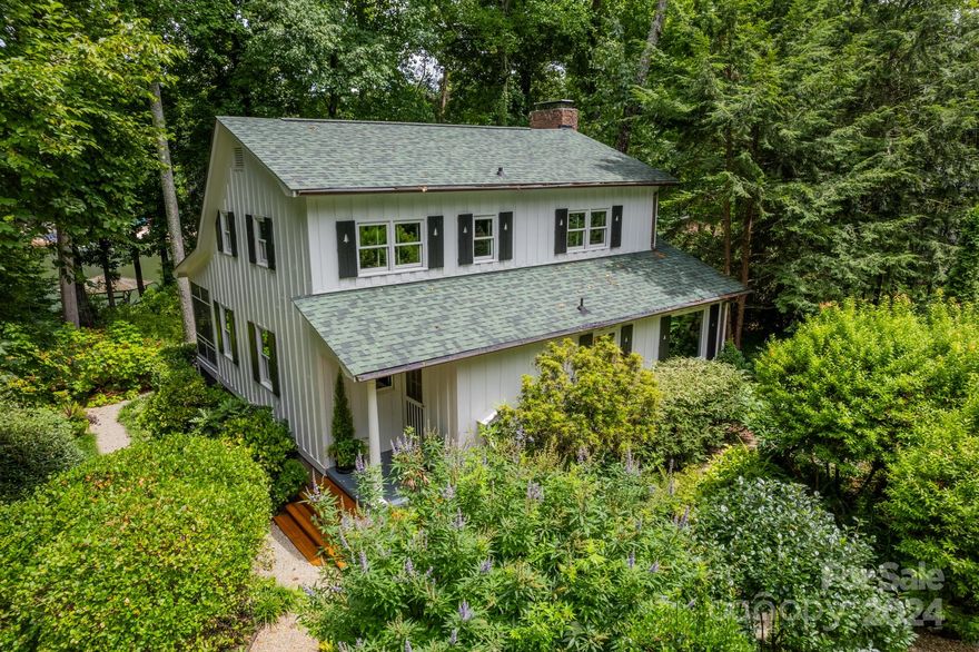 Wonderful, very well-maintained story book cottage features an unbelievable garden & is situated directly on Lake Norman with approximately 151 linear feet of lake frontage on a deep-water cove with main channel views from dock. Marvelous established trees, shrubs and perennials, stone lined pathways, covered stone dining pavilion, 2/car carport, storage building, gazebo on lake with boat slip & separate swim platform are all assets. This charming home has been totally renovated with a custom kitchen & bathrooms, insulated windows, and upgraded lighting & plumbing fixtures throughout. A 32' long screen porch faces the lake, the large living room features a wood burning fireplace & wood floor, & the kitchen is wide open to the living and dining areas. Wonderful kitchen details include granite counter tops, Viking dual fuel range with downdraft, separate ice maker, glass door cabinetry, granite breakfast bar, stainless steel appliances, & upgraded sink and faucet. Tile showers in baths.