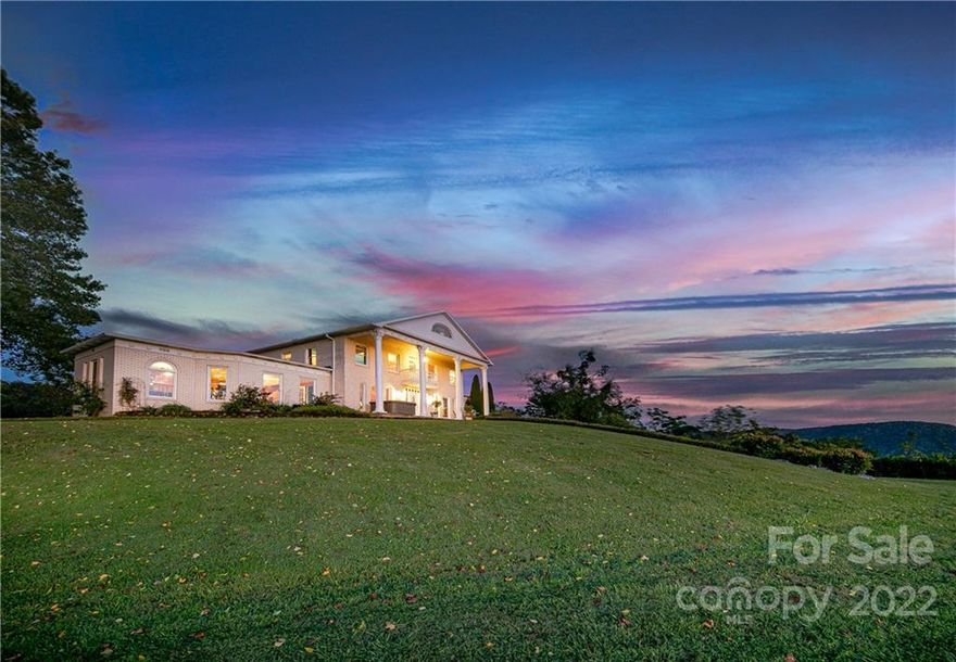 Unique opportunity to own a mountaintop estate only minutes away from everyday conveniences. Rarely does a property check every box for views, setting, and location! Designed after the historic Orton Plantation House, the home features unobstructed long-range southern, western, and eastern views expanding across the Blue Ridge Mountains. It's no wonder why Elvis was once interested in securing this property for himself! With view control around the entire home, nearly 360-degree views can be achieved to experience sunrises and sunsets. The adjacent 41 acres could potentially be purchased for additional opportunities. Elegant columns frame the scene of the distinguished 2-story foyer with a grand staircase. Enjoy an impressive recreation room, theatre, kitchen that opens up to the formal dining room, and three bedrooms all on the main level. The upper level includes an oversized primary bedroom, two additional bedrooms, and an office. Pre-inspected. Appointment required- NO DRIVE BYS.