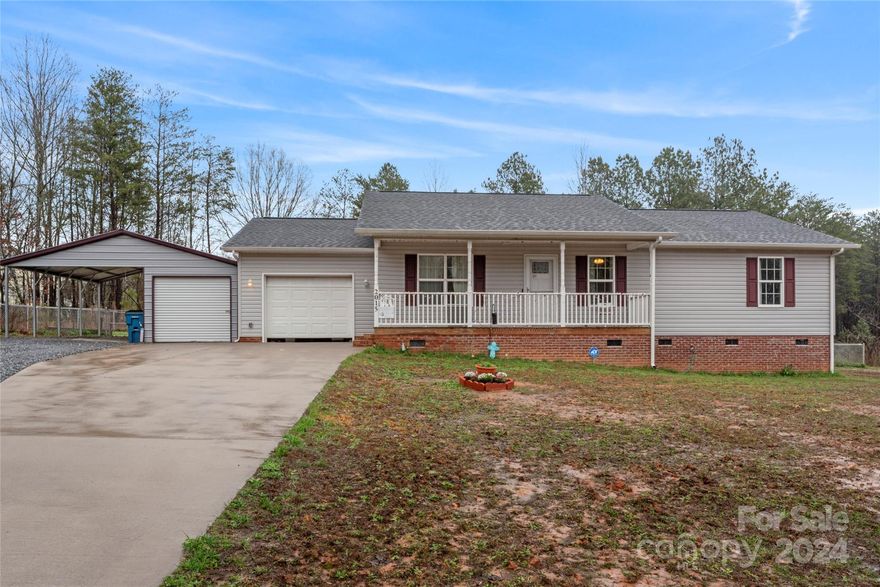 This charming single-story house sits on a 0.70-acre lot and boasts a picturesque view of the lush trees surrounding it. The backyard is completely enclosed with a fence, ensuring both privacy and security. The property comes with a two-car garage, a convenient carport, elegant laminate flooring, and attractive granite countertops. The deck is perfect for outdoor living and has a ramp for easy accessibility.