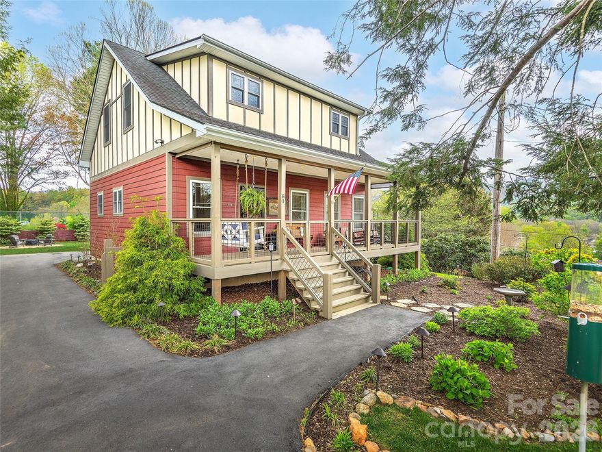 Step into low-maintenance luxury just blocks from Main Street in this light-filled 3-bedroom, 2.5-bath home built in 2016. The open-concept living area centers around a gas log fireplace and flows effortlessly into the stylish kitchen with granite countertops, large island, and a striking stone accent wall—ideal for everyday living and entertaining. The main-level primary suite offers a private retreat with a doublevanity bath and easy, stair-free access. Upstairs, two additional bedrooms, an updated full bath, a cozy sitting area, and a dedicated laundry room provide comfortable space for guests or family. The garage has been thoughtfully finished as a fun flex/entertaining space, expanding how you can live and host. Enjoy the professionally landscaped backyard with a stunning hot tub and plenty of room to relax. Enjoy the professionally landscaped backyard and an unbeatable location just a short walk to Main Street Waynesville, making this an exceptional year-round residence or attractive short-term rental opportunity.