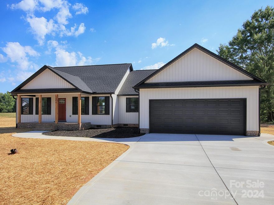 Beautiful rural setting yet  just minutes to grocery shopping and nice restaurants and shopping. You feel like you are in the country, but you are still near Newton, Catawba, Claremont, and Hickory. About 45 minutes to Charlotte via Hwy. 16. Beautiful  Board and Batten siding that gives this construction an almost 3-D look (it's gorgeous). Great room boasts a floor-to-ceiling stone veneer fireplace with gas logs. Two porches, front and back and the porch in the back is partially covered and partially open for your evening or weekend barbecues! Drop zone just off the kitchen coming in from the garage and a large laundry off the drop zone. Split bedroom plan with privacy in mind for the primary bedroom and bath. The primary bath has a private water closet and a walk in tiled shower. Open kitchen with an island (think breakfast nook), and beautiful cabinetry and granite countertops.  But oh that pantry!! Walk in pantry with a decorative barn door! Complete for quick occupancy.