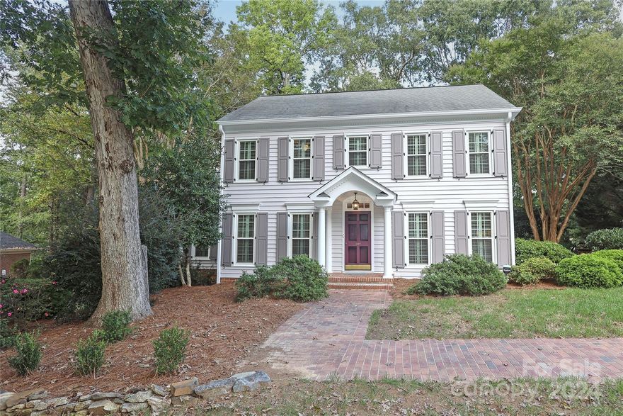 Find easy living in this beautifully updated Colonial style home in the highly desirable Foxcroft neighborhood.  Floor plan features primary BR suite on main level with new bathroom & four living areas: family room with fireplace, living room/adult lounge with built-ins, a studio/office/craft room adjacent to the kitchen and a large bonus room - plenty of places for gathering together. The newly renovated backyard features a patio and deck, perfect for outdoor entertaining, overlooking a serene wooded backdrop with direct access to nearly 5 miles of private, shaded neighborhood walking trails. Freshly painted exterior, new shutters and all new windows, this home also includes very recently installed HVAC systems and kitchen appliances.  Three additional bedrooms and a full bath upstairs.  A tranquil setting in a convenient location close to Southpark's shopping, dining & retail and midway between Uptown and Ballantyne.  Two neighborhood swim & racquet clubs, memberships required.