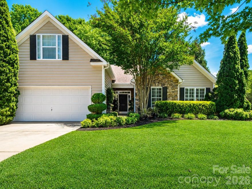 Perfectly positioned in Indian Land, Legacy Park places you right between Charlotte/Ballantyne, Waxhaw, and Fort Mill—giving you the flexibility to enjoy the best of all three areas within minutes! Seller is offering a 1-year Choice Home Warranty, providing added peace of mind for the next owner. Tucked away on a beautifully landscaped corner lot in sought-after Legacy Park, this charming home offers the feel of a private retreat. The backyard features extensive hardscaping and landscaping, creating an inviting outdoor living environment ideal for relaxing or entertaining. Architectural privacy fencing creates a peaceful, sanctuary-like setting, while a covered porch and irrigation system help maintain the lush outdoor space to enjoy year-round.
Inside, the home showcases soaring 9 and 10-foot ceilings and a cathedral ceiling in the open living room, filling the space with natural light and an airy feel. Architectural details throughout include arched entryways, extensive crown molding, and wood plantation shutters on every window throughout the entire home, adding warmth and timeless character. The dining room features a striking 10-foot coffered ceiling, crown molding, and elegant wainscoting, creating a beautiful setting for gatherings. The kitchen blends style and function with 42" solid wood cherry cabinetry, granite countertops, and updated stainless steel appliances. The primary suite is a private retreat overlooking the tranquil backyard, featuring 10-foot coffered ceilings, crown molding, and ceiling fans in both the bedroom and the separate sitting area, as well as a walk-in closet. The ensuite bath offers a soaking tub, separate shower, and a private water closet for added comfort. A Private finished room over the garage functions as a 4th bedroom, featuring a walk-in closet and enclosed access perfect for guests, a home office, or a media retreat.
Additional highlights include a cohesive, soothing neutral color palette, updated energy-saving LED lighting, surround sound, alarm system, and biannual HVAC and irrigation system servicing.  Legacy Park is a thriving community featuring an active HOA and outstanding amenities—all offered at an incredible value. Enjoy resort-style living with an Olympic-sized pool complete with two slides and a concession stand, a clubhouse perfect for gatherings with an on-site fitness center, as well as tennis and basketball courts. The community also features a stocked fishing pond and a vibrant social calendar with events like bingo nights, food trucks, and more. 
Feature sheet and Legacy Park amenities sheet attached with additional details.
