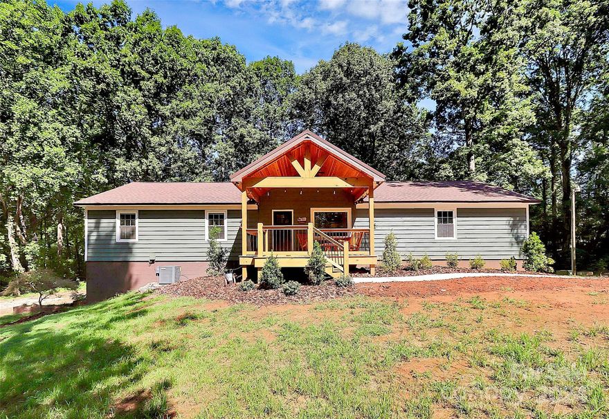 SELLER OFFERING UP TO $10,000 TOWARD SELLER PAID BUY DOWN OR CLOSING COST w/ACCEPTABLE OFFER! Discover unparalleled privacy and modernized opulence in this exceptional 4.5 acre estate in the heart of Mooresville, NC! This rare gem has so much to offer including a full apartment style basement with its own separate entrance. Sellers did a complete upgrade to the property which includes all new white cabinetry, quartz countertops and stainless steel appliances in the kitchen. Luxury vinyl tile all throughout the main level of the home. Owners suite was updated with a new shower, double sink vanity and light fixture. The roof was replaced in 2021, all previous decks were restored, and all interior/exterior doors and windows were replaced. The timber in front of the home was all cleared to make way for a gated entry! Yes, you read right, the home is gated! There are just too many upgrades to list, so bring your buyers to this beauty ASAP before its too late.