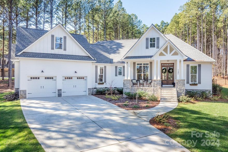 Simply stunning! Gorgeous from the minute you pull into the driveway! Welcoming front porch. Stepping thru the double front doors into the open floorplan you immediately notice all of the attention to detail. Beautiful hardwoods thru out most of main floor. Great Room has vaulted ceiling, fireplace w/built ins, slider doors to the covered patio & Pool. Kitchen is a dream with large island, gas cooktop, gorgeous counters & cabinets. Primary bedroom on main with spa like bath that will not disappoint. Split bedroom floorplan puts 2 secondary bedrooms on main as well with J&J bathroom. Main floor also features an office area, walk in pantry, large laundry room & half bath. Upstairs has bonus room/full bath. Large 1.55 acre lot tucked in just before the end of the cul-de-sac. Backyard oasis is already in place. Covered patio w/stone FP, in-ground pool, fenced backyard that backs to trees. Plenty of privacy. This gated community features day docks on Lake Norman.