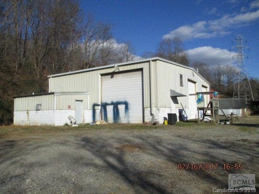 Great opportunity for this 2.37 acre parcel just off I-40 with large approx 2616 SF workshop/service area. The PIN number and record number are part of larger tract not yet split by burke county mapping. Survey of property in office.