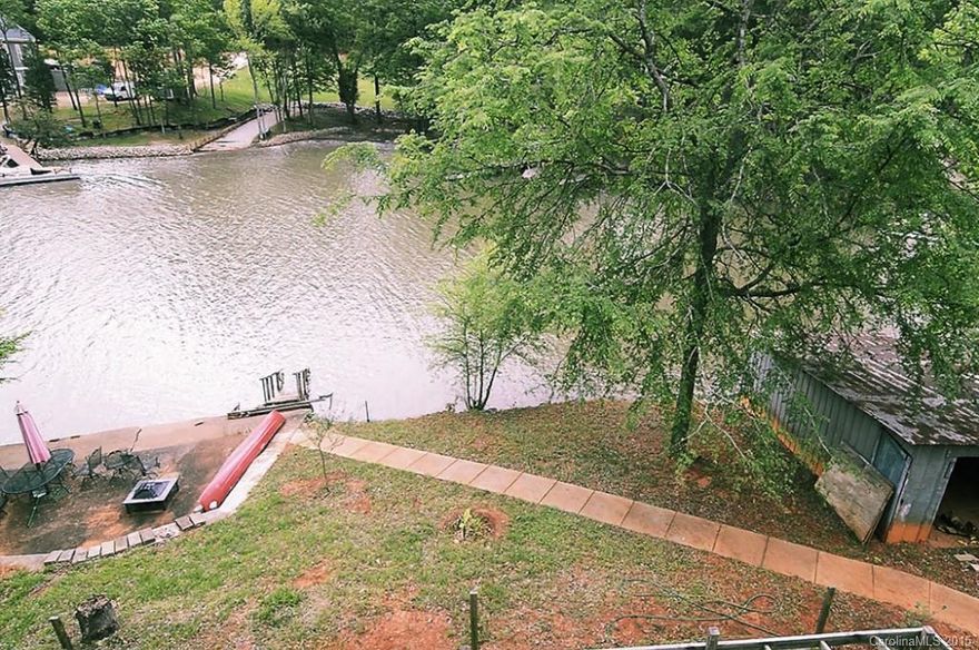 New Price! Lake Wylie waterfront custom home. Over 5000 s.f. of HLA and an unfinished basement to expand! Great views of Lake and cove. Awesome kitchen with huge island, granite, stainless appliances and large pantry. Large deck and balcony overlooking the water.  Lots of room to entertain. Low profile stairs for an easy climb.  Built in 2006. Boat house. Amazing master suite with huge closet with custom built-ins.