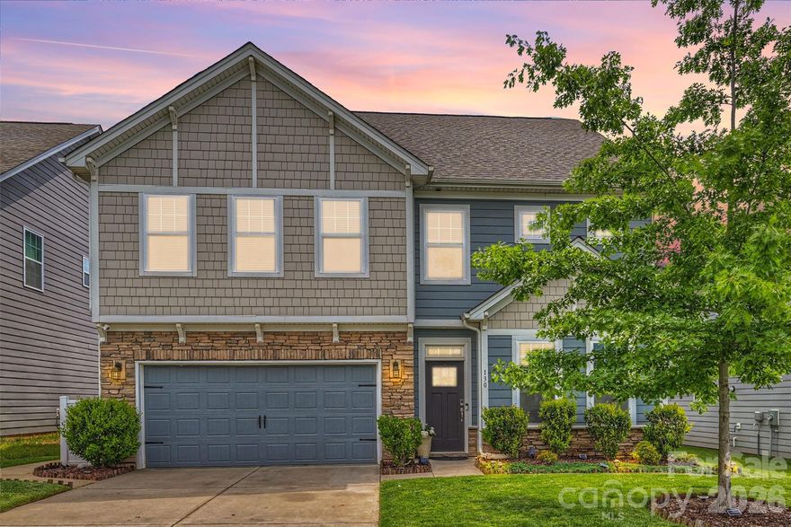 A $40,000 backyard transformation featuring tiered travertine-tile terraces and a $7,000 custom primary closet set the standard for this meticulously upgraded Atwater Landing home — where refined outdoor living meets the best of the Lake Norman lifestyle.

Outdoor Living, Reimagined

The seller spared no expense in creating a stylish, low-maintenance retreat designed for both effortless entertaining and everyday relaxation. A fully fenced backyard delivers privacy while maintaining direct access to community common areas — including the green space at the front of the home — striking an ideal balance between personal sanctuary and neighborhood connection.

Modern Finishes, Exceptional Efficiency

Freshly painted throughout, this 5-bedroom, 4-bath home pairs premium finishes with remarkable energy performance. A high-efficiency tankless water heater delivers an endless hot water supply, and the EV-ready garage comes pre-wired for a Tesla charger — all contributing to surprisingly low monthly electric bills. Updated designer lighting, elegant coffered ceilings in the dining room, classic wainscoting, and refreshed bathrooms give every room a crisp, contemporary feel.

The Heart of the Home

The extended chef's kitchen was built for gathering — an oversized island, double ovens, gas cooktop, dedicated prep and serving space, and a massive walk-in pantry flow seamlessly into the open-concept living areas.

Flexible Living on Every Level

A main-level bedroom offers easy flexibility as a private home office or guest suite. Upstairs, the expansive primary retreat features a tray ceiling and generous custom walk-in closet, while double doors open to an oversized bonus room — perfect as a media lounge, playroom, or secondary living area.

The Atwater Landing Lifestyle

Kayak and paddleboard storage, a private launch site, resort-style pool, fitness center, clubhouse, playgrounds, and scenic walking trails — all just minutes from Mooresville shopping, I-77 access, Troutman conveniences, and Lake Norman State Park.

Premium upgrades. Intelligent efficiency. Resort-style amenities. This is the complete Lake Norman living experience.