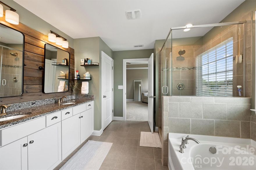 A $40,000 backyard transformation featuring tiered travertine-tile terraces and a $7,000 custom primary closet set the standard for this meticulously upgraded Atwater Landing home — where refined outdoor living meets the best of the Lake Norman lifestyle.

Outdoor Living, Reimagined

The seller spared no expense in creating a stylish, low-maintenance retreat designed for both effortless entertaining and everyday relaxation. A fully fenced backyard delivers privacy while maintaining direct access to community common areas — including the green space at the front of the home — striking an ideal balance between personal sanctuary and neighborhood connection.

Modern Finishes, Exceptional Efficiency

Freshly painted throughout, this 5-bedroom, 4-bath home pairs premium finishes with remarkable energy performance. A high-efficiency tankless water heater delivers an endless hot water supply, and the EV-ready garage comes pre-wired for a Tesla charger — all contributing to surprisingly low monthly electric bills. Updated designer lighting, elegant coffered ceilings in the dining room, classic wainscoting, and refreshed bathrooms give every room a crisp, contemporary feel.

The Heart of the Home

The extended chef's kitchen was built for gathering — an oversized island, double ovens, gas cooktop, dedicated prep and serving space, and a massive walk-in pantry flow seamlessly into the open-concept living areas.

Flexible Living on Every Level

A main-level bedroom offers easy flexibility as a private home office or guest suite. Upstairs, the expansive primary retreat features a tray ceiling and generous custom walk-in closet, while double doors open to an oversized bonus room — perfect as a media lounge, playroom, or secondary living area.

The Atwater Landing Lifestyle

Kayak and paddleboard storage, a private launch site, resort-style pool, fitness center, clubhouse, playgrounds, and scenic walking trails — all just minutes from Mooresville shopping, I-77 access, Troutman conveniences, and Lake Norman State Park.

Premium upgrades. Intelligent efficiency. Resort-style amenities. This is the complete Lake Norman living experience.