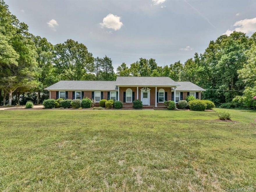 Welcome Home to this Full Brick Beauty with a Large Southern Front Porch on an Lovely Mature Country Acre Just Minutes from Town & I-77! Offers a Large Den plus a combination Living Room & Dining Room. Spacious Kitchen with Breakfast Area. Master with private bath. Huge Laundry/Storage/Pantry Room. Great sized Outdoor Storage Building. 2 Car Side-load Garage and lots of concrete parking spaces for your car, boat and RV!